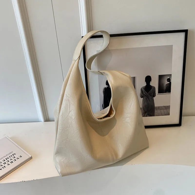 Soft PU leather casual shoulder bag with large capacity and street style design