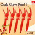 Ballpoint pen with pressable crab-shaped metal clip