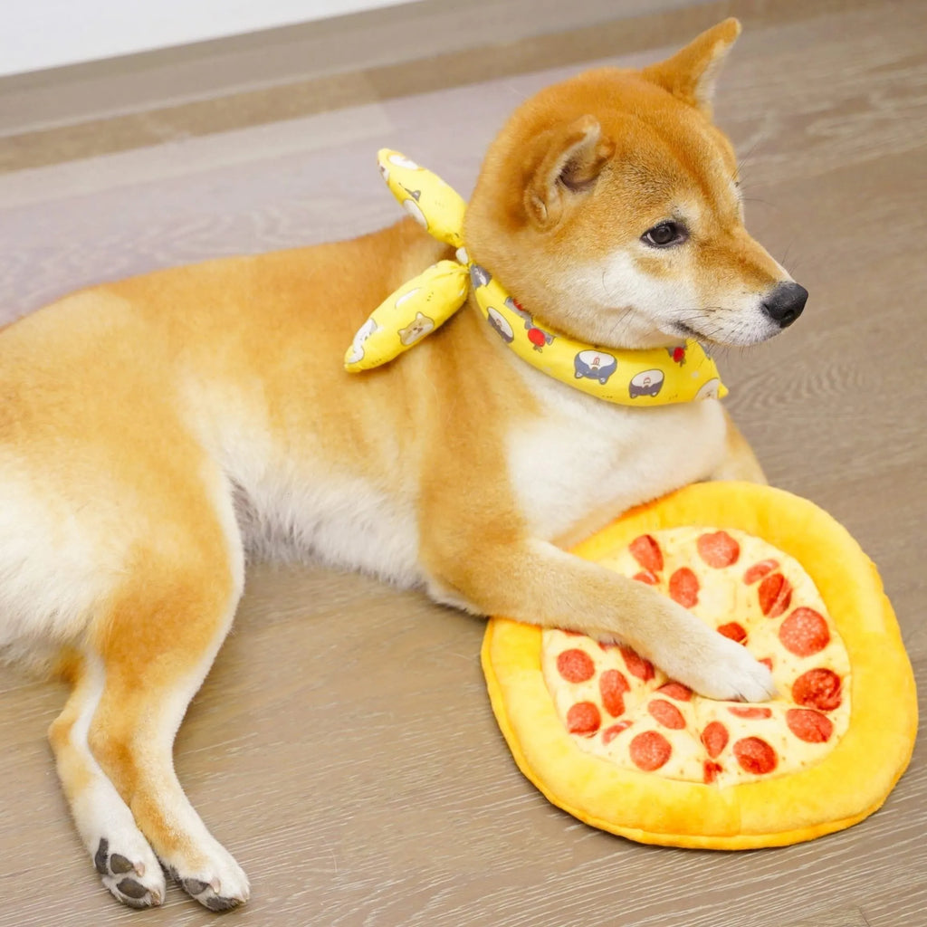 Yellow pizza slice shaped soft fabric dog chew toy with internal squeaker.