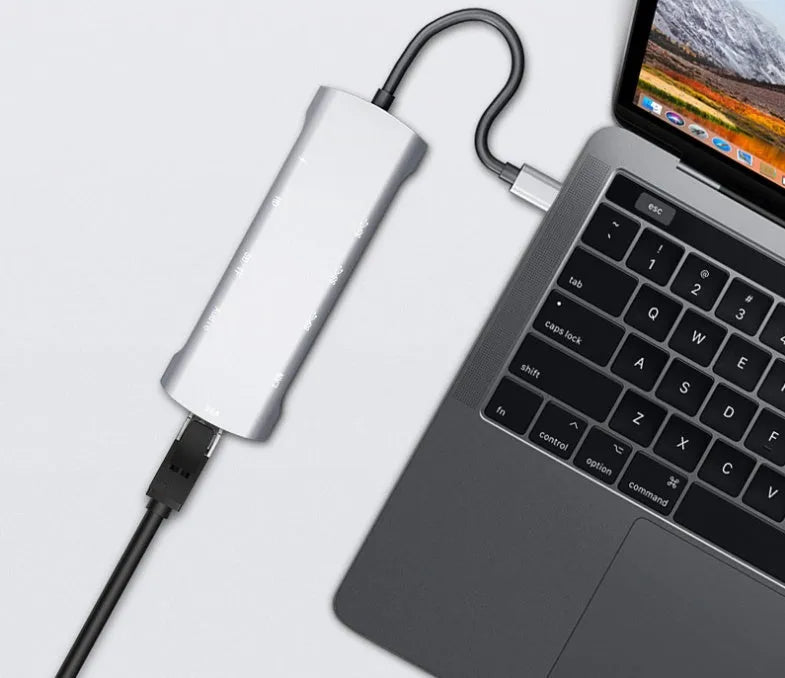 Grey USB-C docking station with aluminium alloy shell and multiple connectivity ports