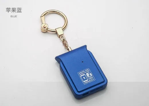 Black leather Bluetooth dual SIM adapter keychain for iOS phones with micro USB port.