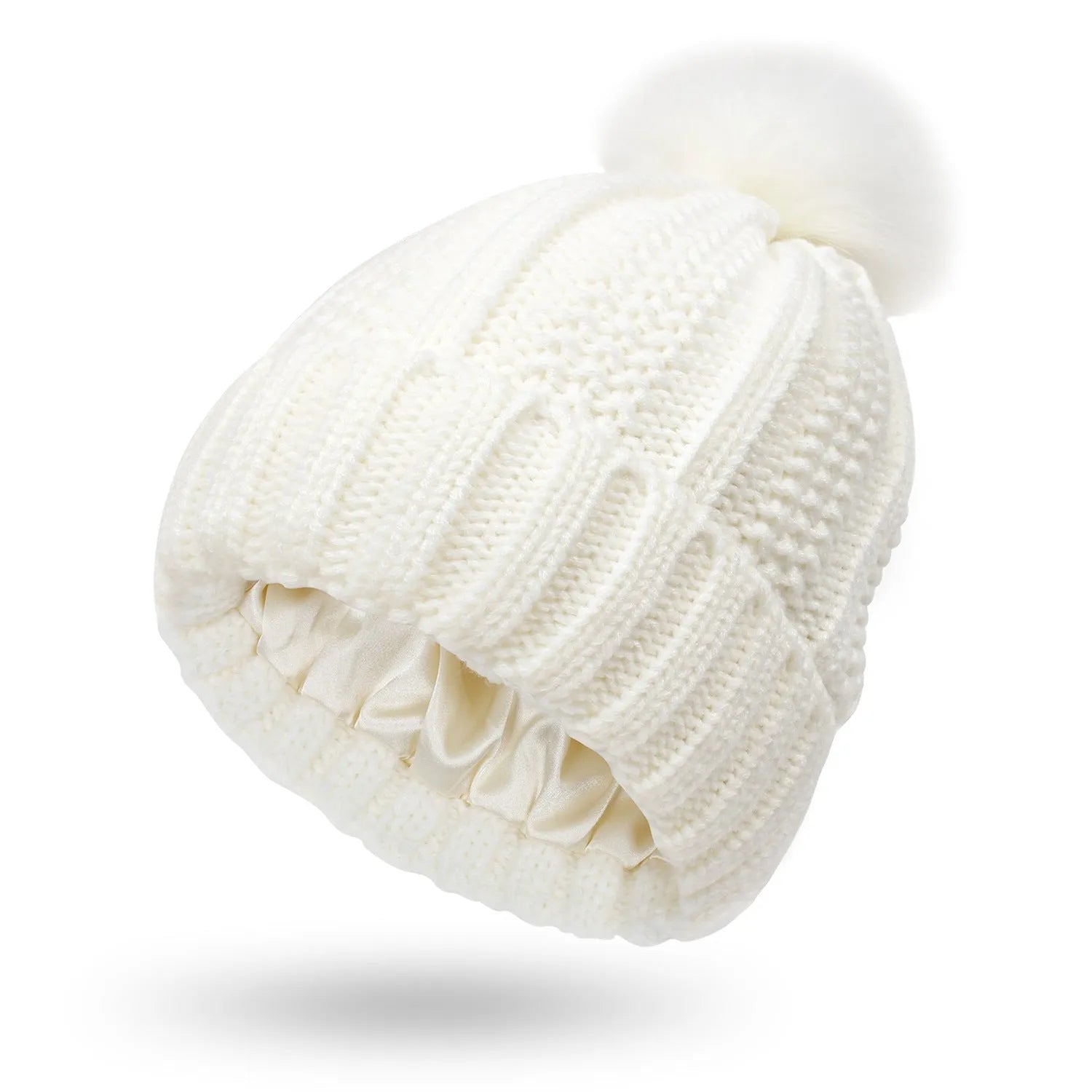 Women's black knit beanie with a faux fur pom pom and satin lining for hair protection