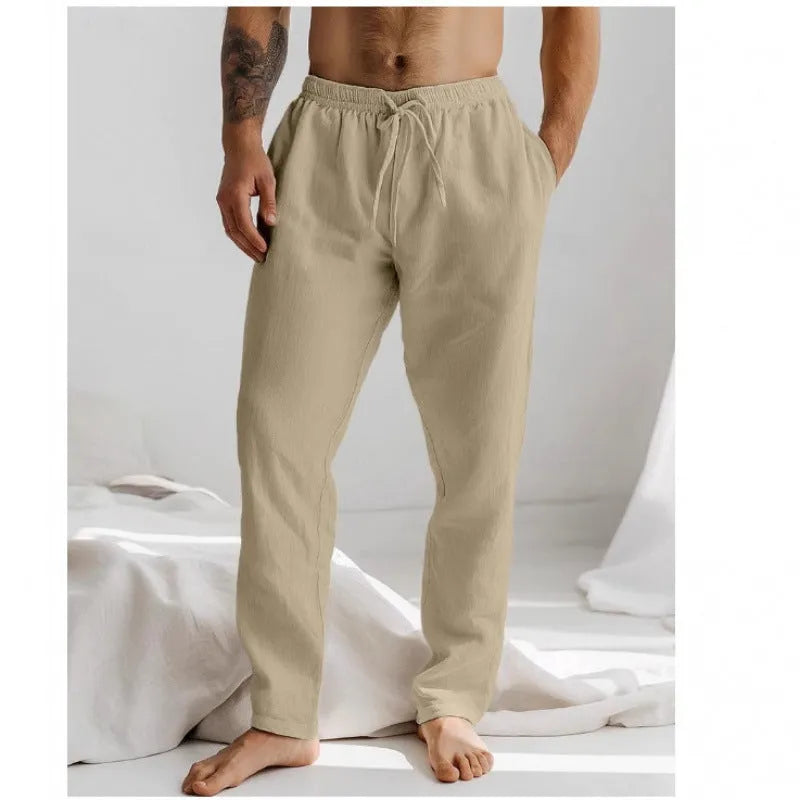 Men's loose straight-leg trousers in light blue with an elastic waistband and drawstring detail.