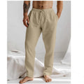 Men's loose straight-leg trousers in light blue with an elastic waistband and drawstring detail.
