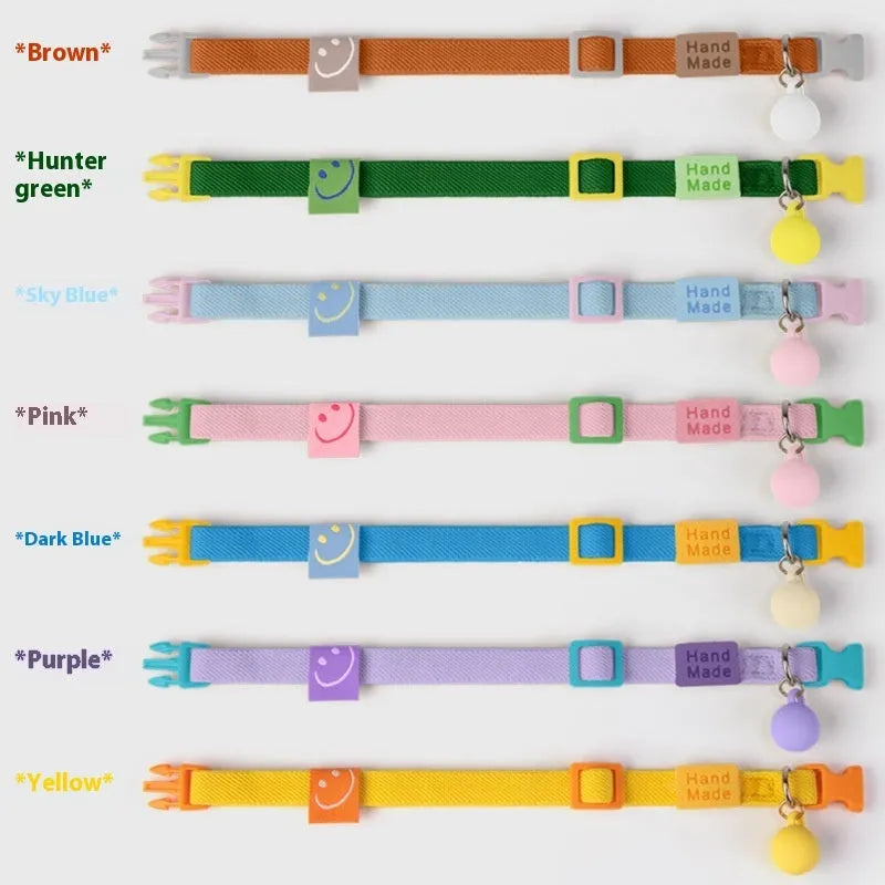 Small dog elastic polyester pet collar in seven colour options showing yellow, pink, and blue examples