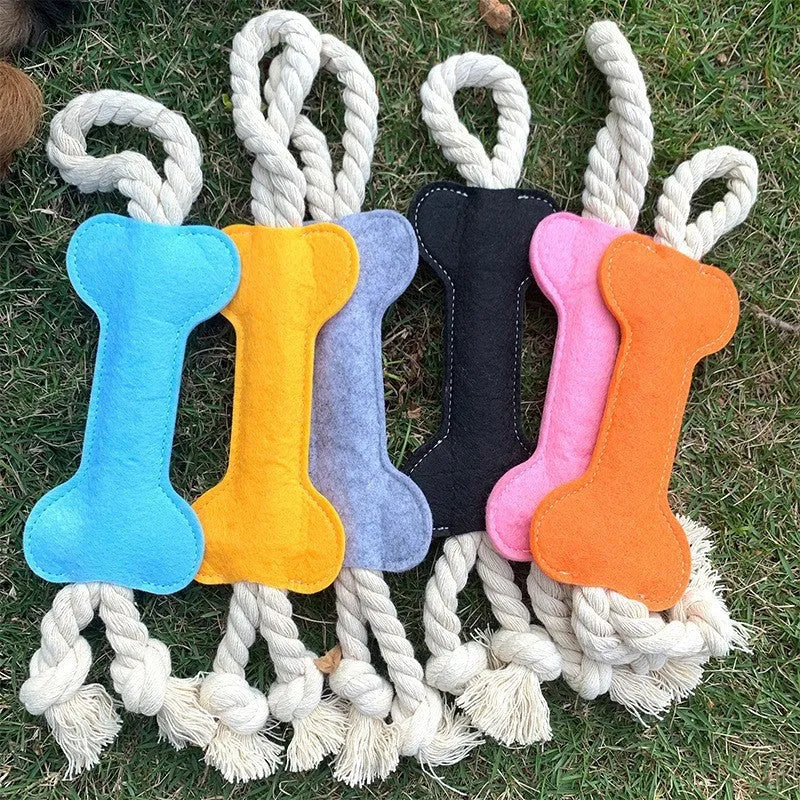 Bone-shaped dog chew toy in felt fabric with rope detailing, shown in various colours