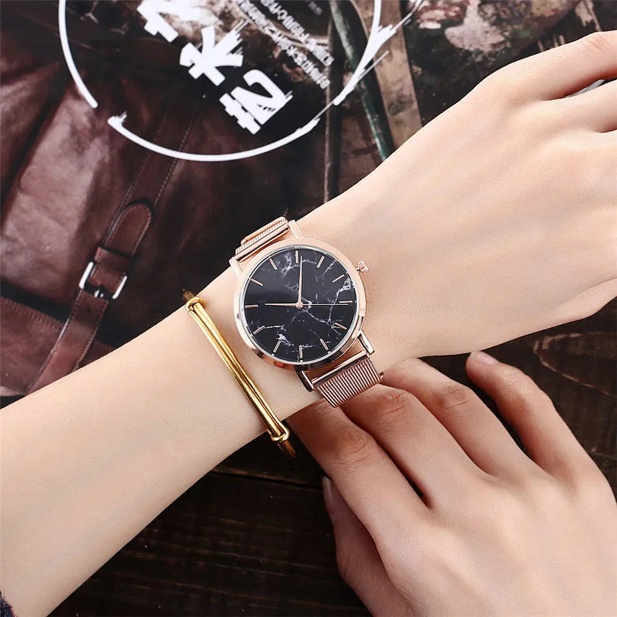 Vansvar women's quartz watch with silver mesh band and marble dial