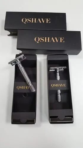 Double-edged safety razor kit with chrome finish, weighted handle, blades, and storage box