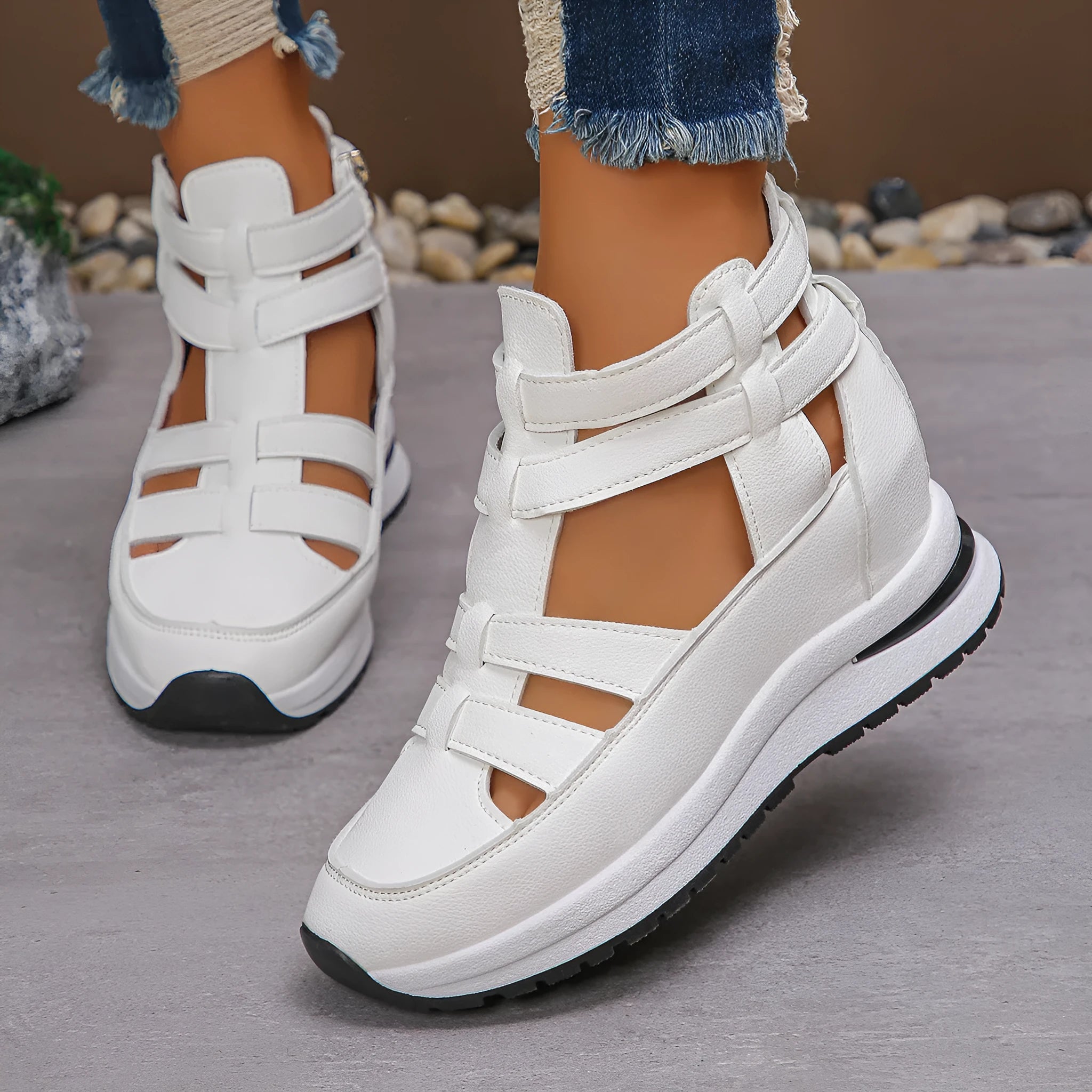 Women's black close-toed hollow-out platform sandals with Velcro strap on a white background