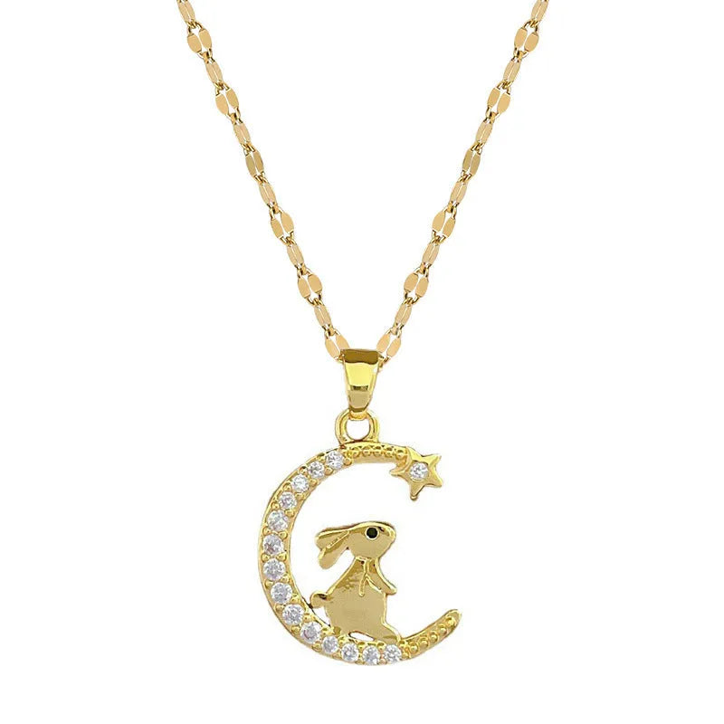 Gold colour copper rabbit and crescent moon full diamond necklace with micro inlay setting on studio background