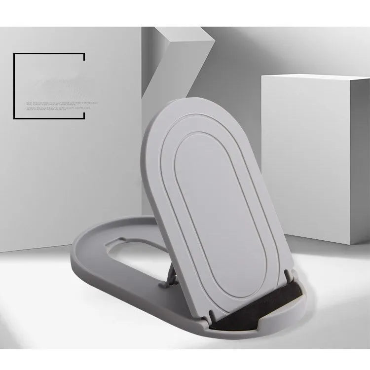 Plastic lazy bracket mobile phone stand in multiple colours on a desk