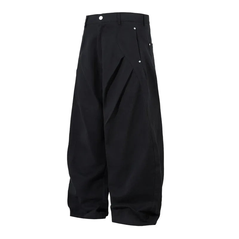 Men's black cotton loose-fit wide-leg trousers with machete pleats and an elasticated waistband