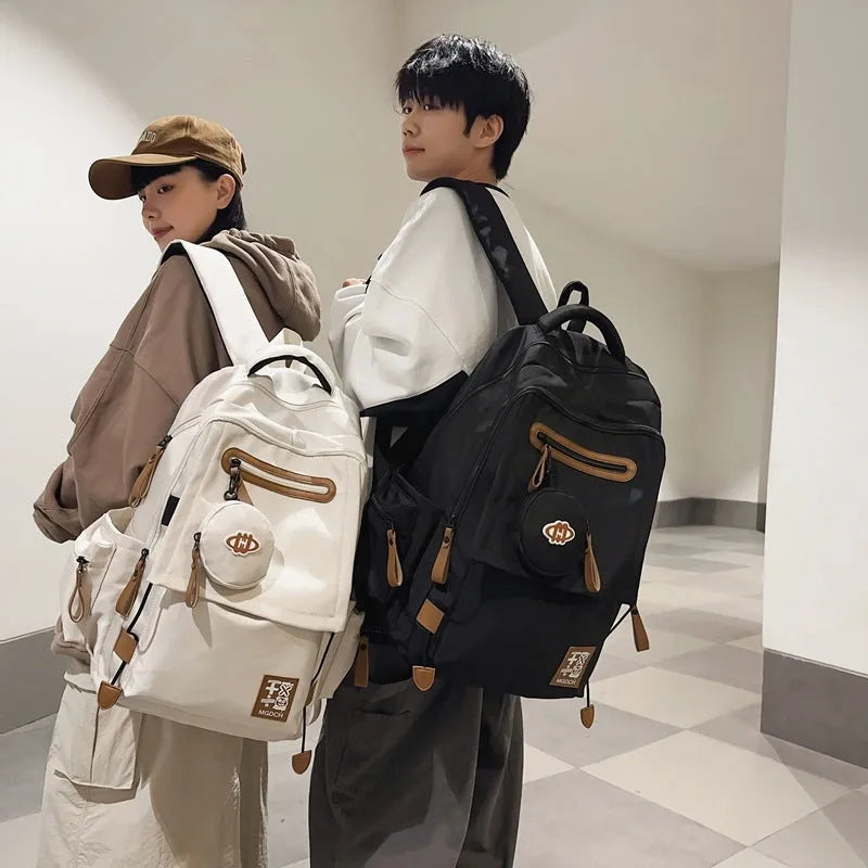Nylon school backpack with curved shoulder straps in multiple colour options including khaki and red