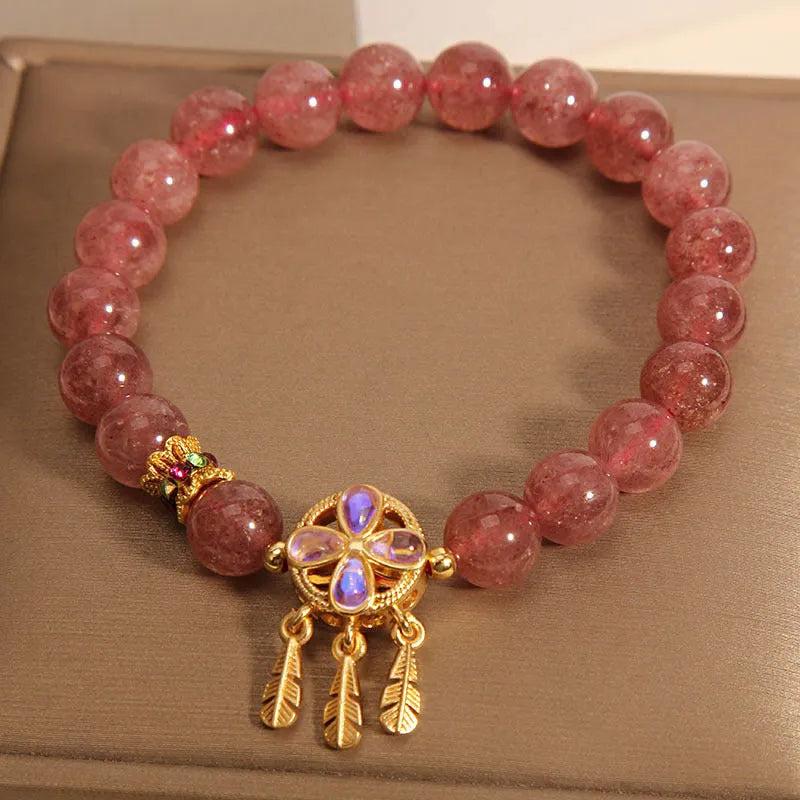 Women's crystal bracelet with strawberry quartz dream catcher ball pendant, original design.