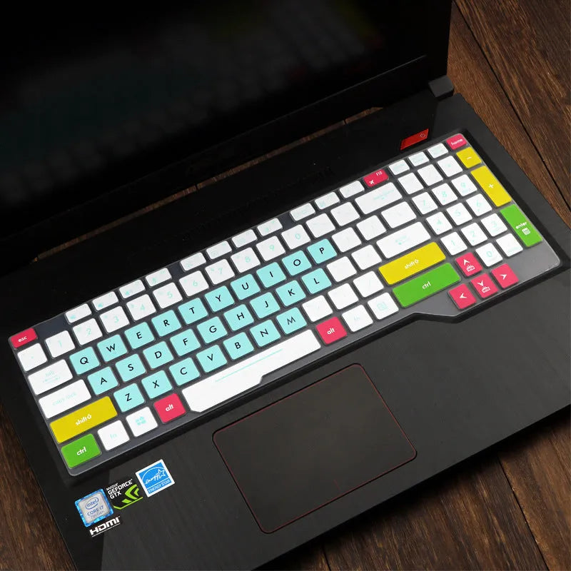 Clear protective keyboard film cover for ASUS Flight 14-inch laptop on a keyboard.