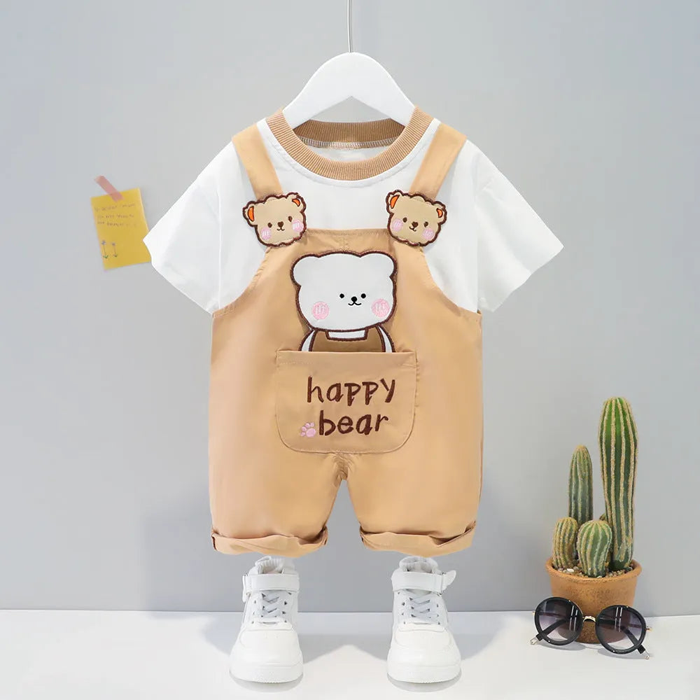 Yellow cartoon print cotton baby overalls with short sleeves and adjustable shoulder straps on a hanger.
