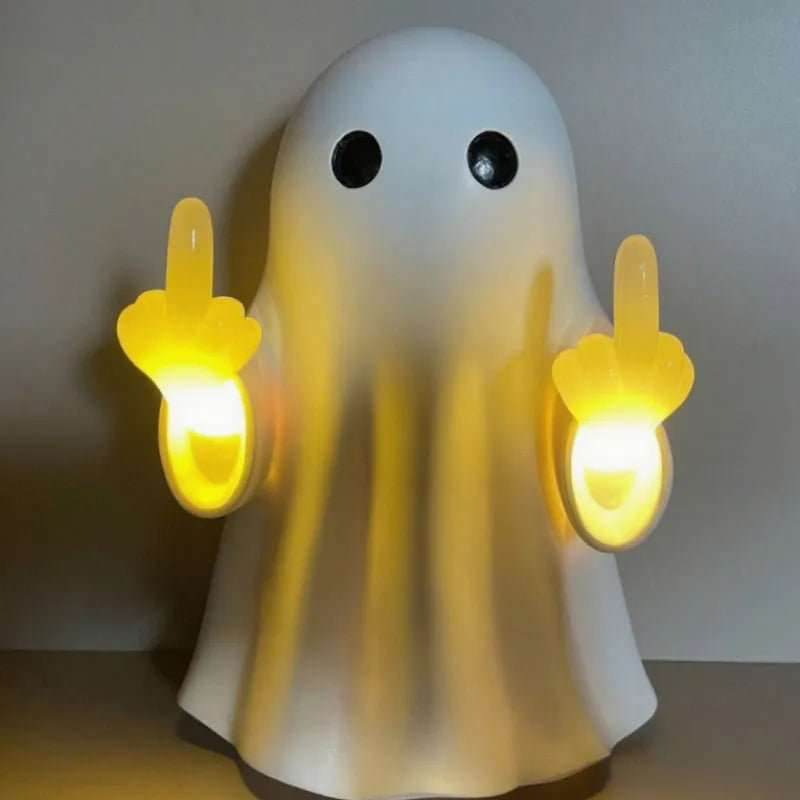 Small white modern ghost statue night light for Halloween decoration on a table.