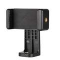 Black plastic rotating clamp phone holder on a desk, showing compact size and adjustable angle.