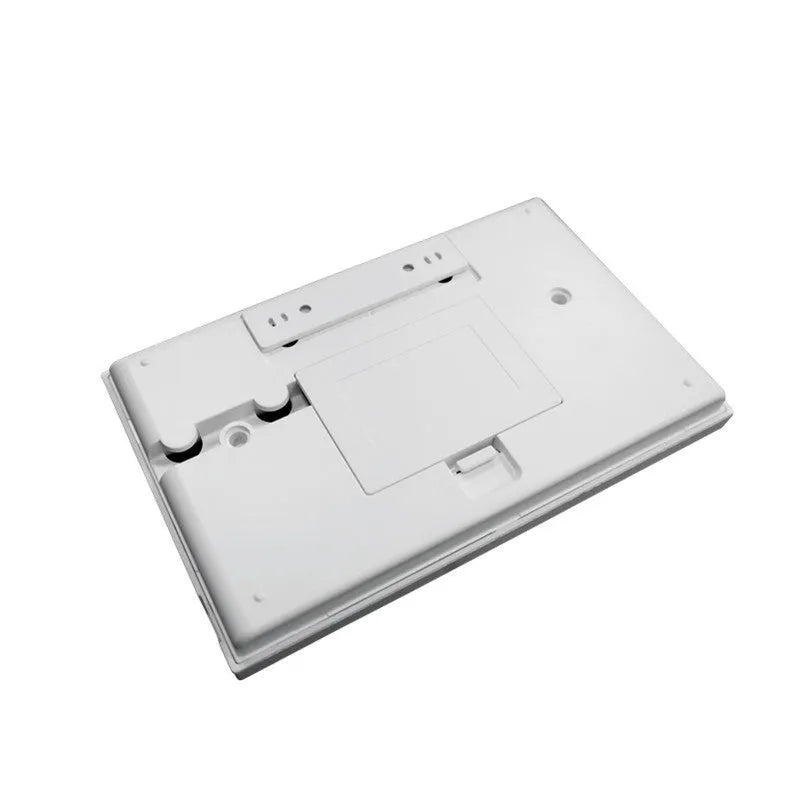 Intelligent WiFi GSM touch button household burglar alarm host unit on a table.