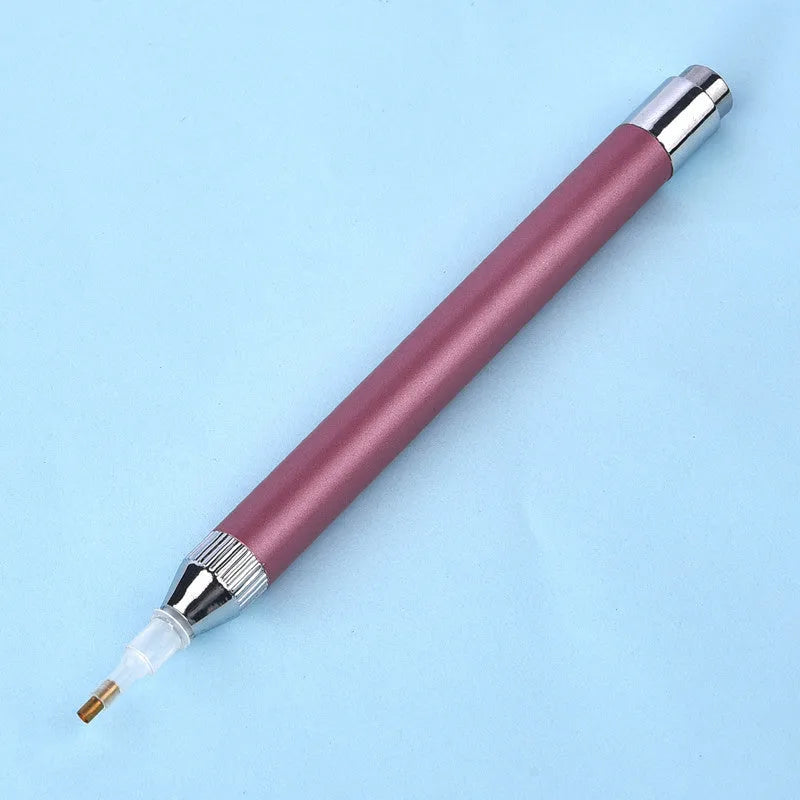 Aluminium alloy luminous drill pen for diamond painting in gold, red, or blue colour.