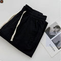 Men's loose straight leg casual pants in thin summer fabric with drawstring waistband