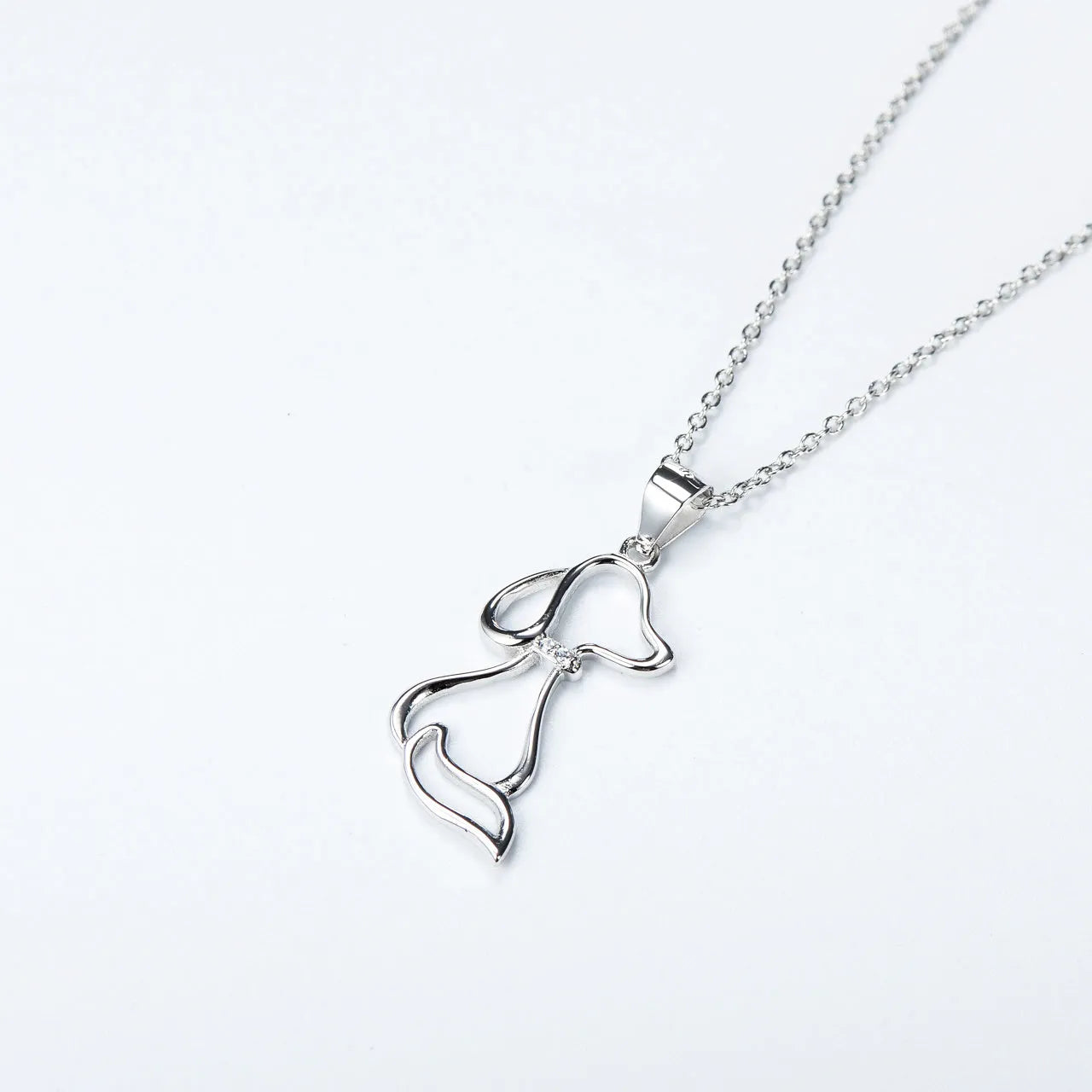 925 sterling silver dog pendant necklace with round bead chain on display