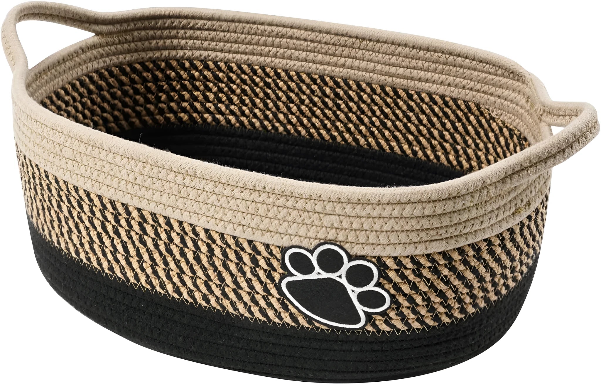 Light beige handmade woven cotton rope storage basket with handle on a wooden surface.