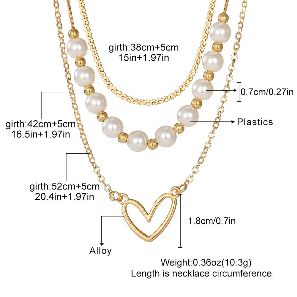 Vintage gold necklace with heart pendant on pearl-style chain, adjustable 41-50cm length