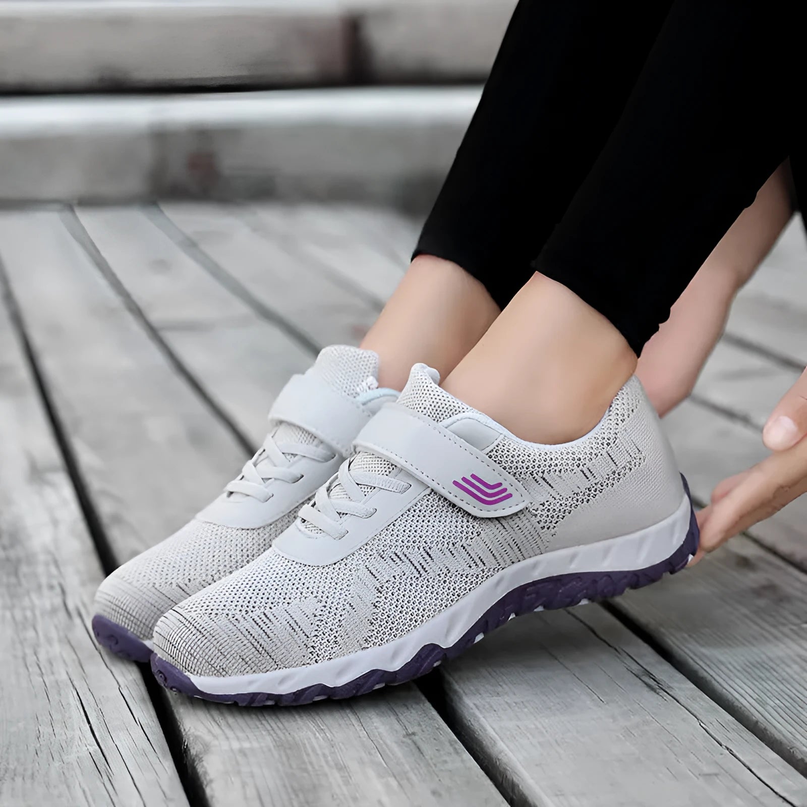 Women's low-top sneakers with Velcro straps and a wedge heel, in a mesh upper and solid colour.