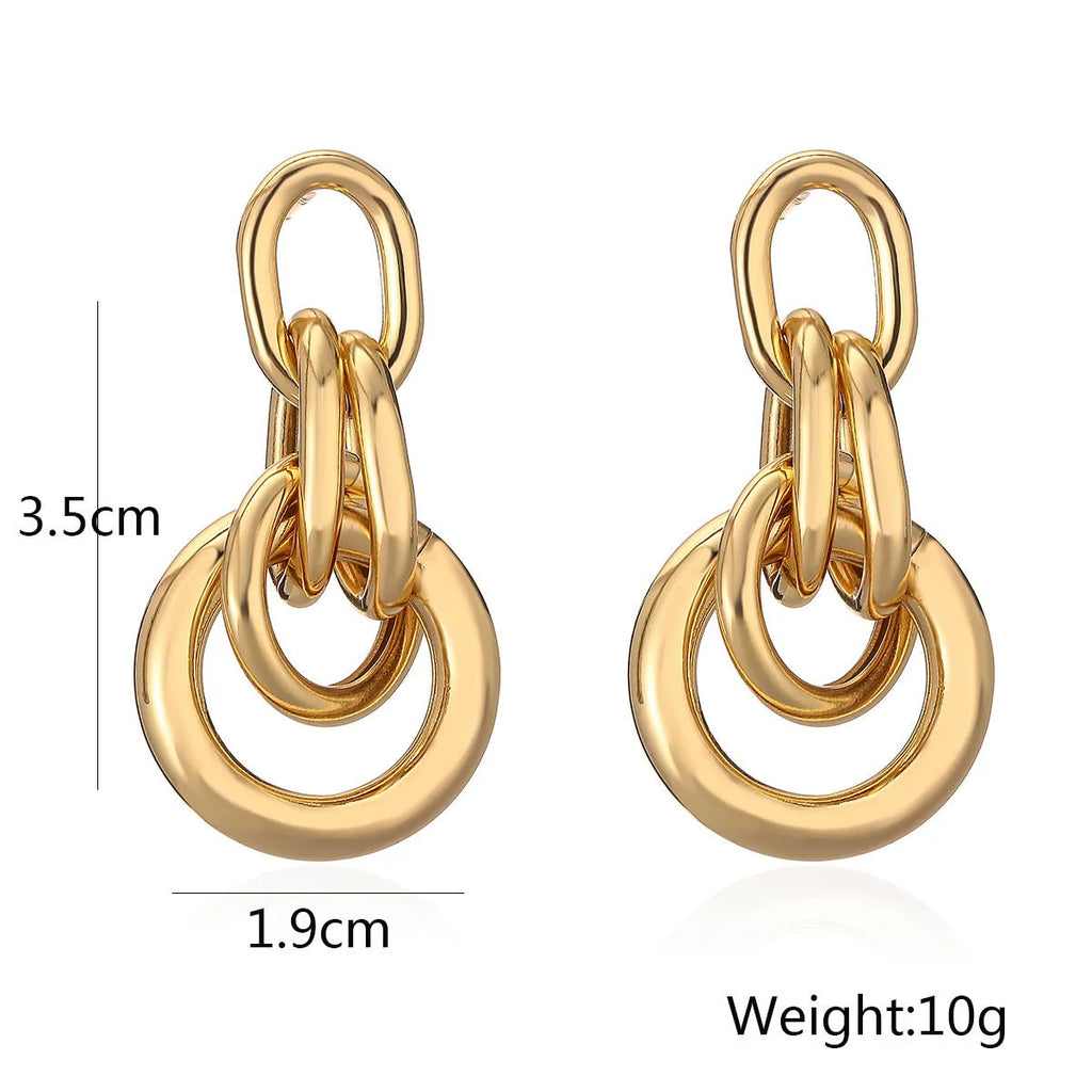 Women's gold geometric earrings with irregular shapes and high-profile metallic style