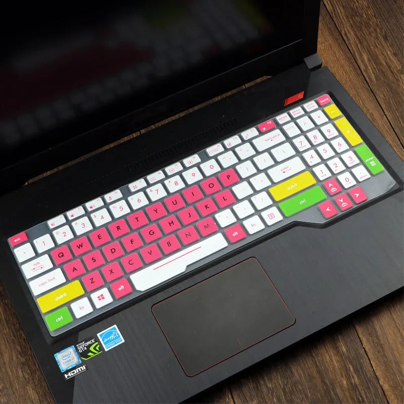 Clear protective keyboard film cover for ASUS Flight 14-inch laptop on a keyboard.