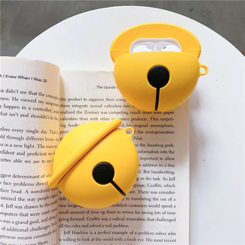 Yellow silicone case with bell charm for AirPods 1 and 2 generation wireless earphones