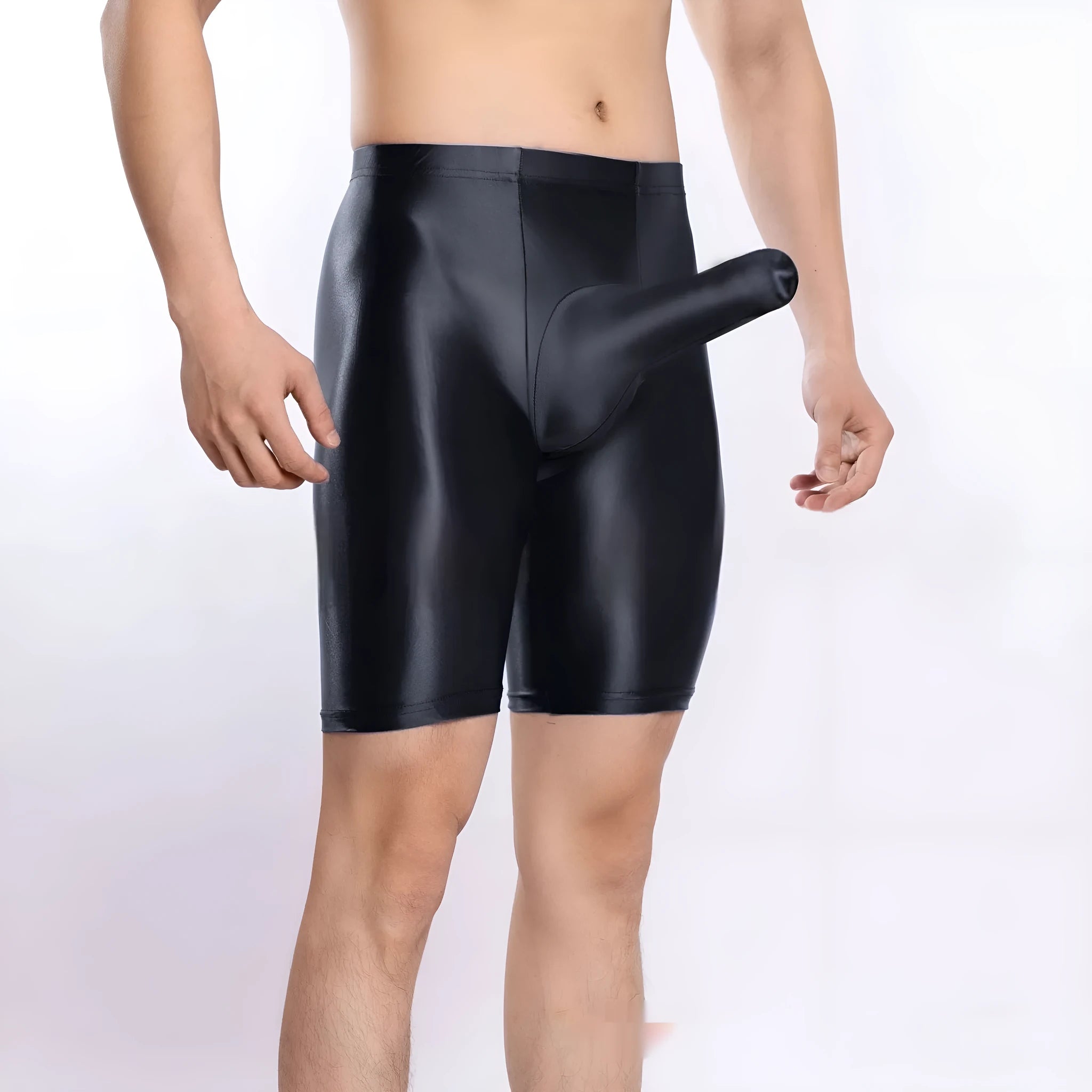 Man wearing shiny black plus size nylon sports shorts, showing silky finish.