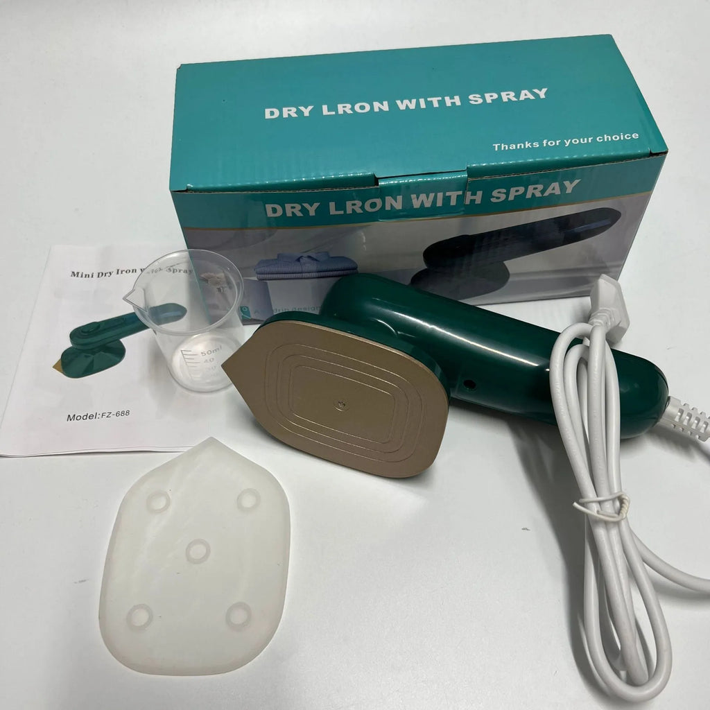 Handheld portable garment steamer in dark green with large titanium soleplate