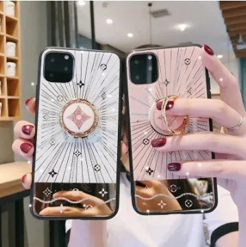 Luxury diamond and gold iPhone ring stand holding iPhone in rose gold finish