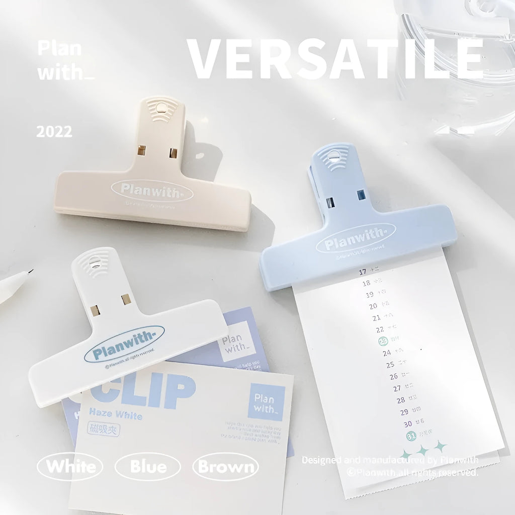 Blue and brown magnetic plastic bill clip holding paper tickets and receipts.