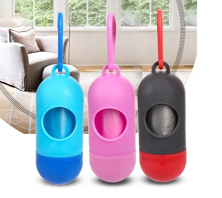 Roll of coloured disposable pet waste bags showing black, blue, green, light blue, pink, and purple options.