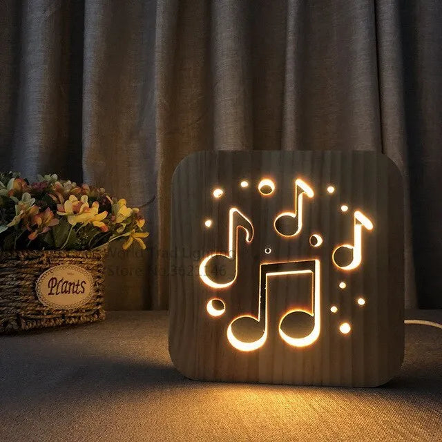 Square pine wood USB-powered LED lamp emitting warm white light on a desk.