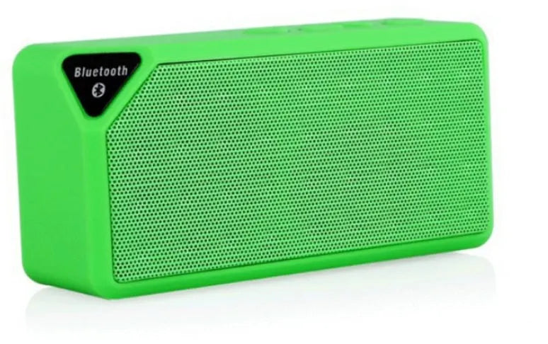 Cannon X3 small cube-shaped portable Bluetooth speaker in multiple colours on a table
