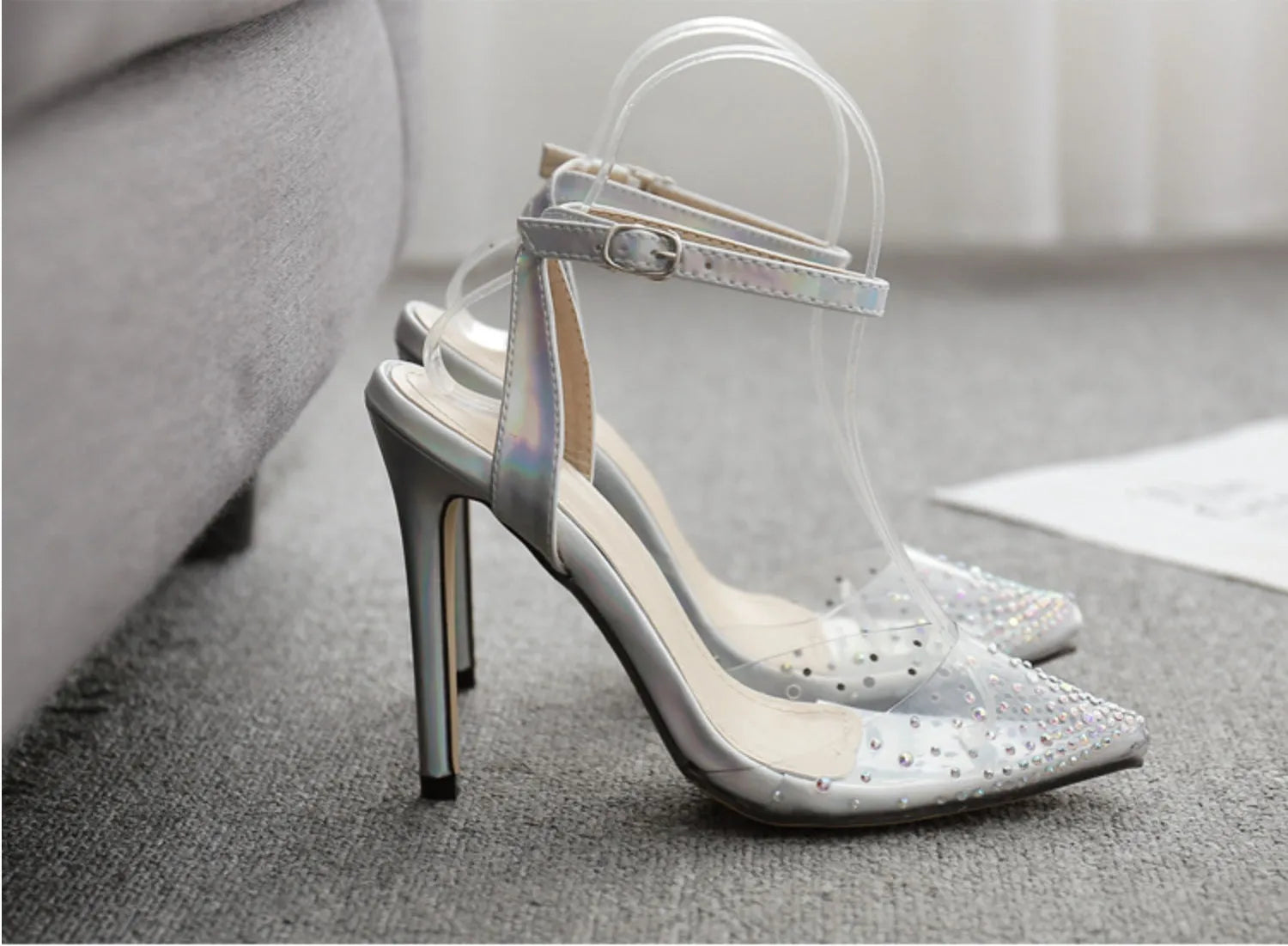 Women's pointed toe stiletto sandals with diamond detail on the PVC upper.