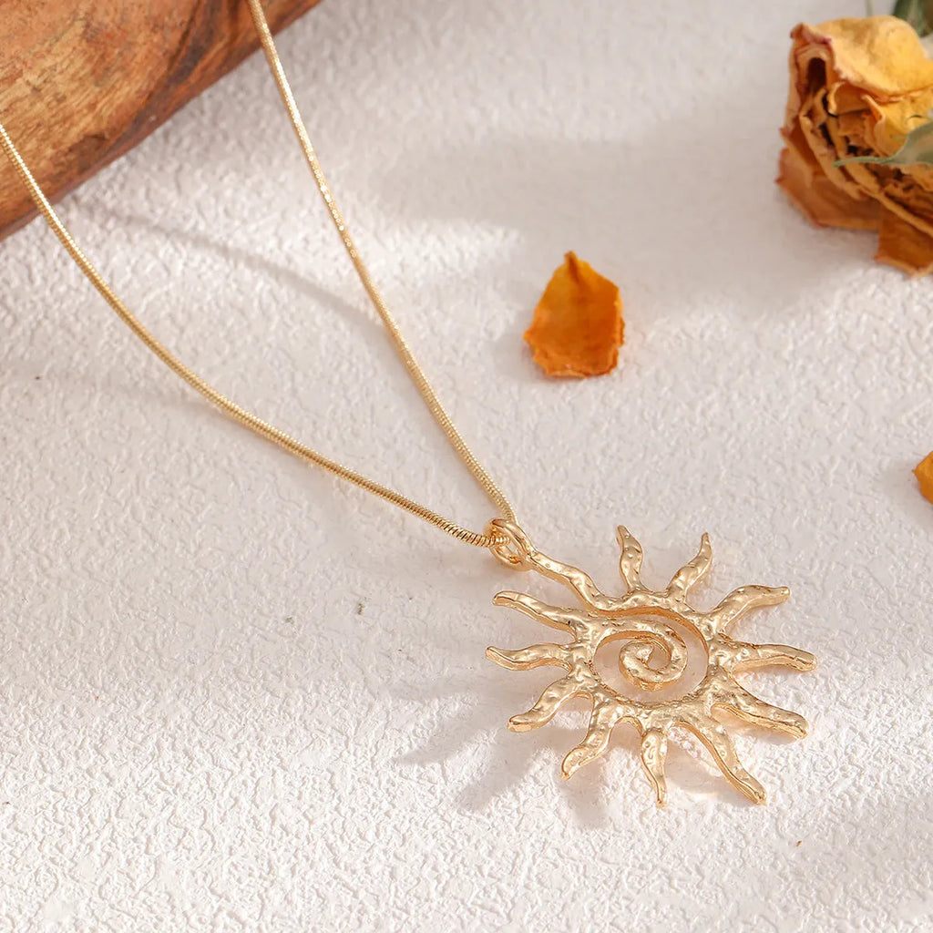 Gold sun hollow pendant necklace on regular chain with matching earrings and ring in zinc alloy electroplated finish