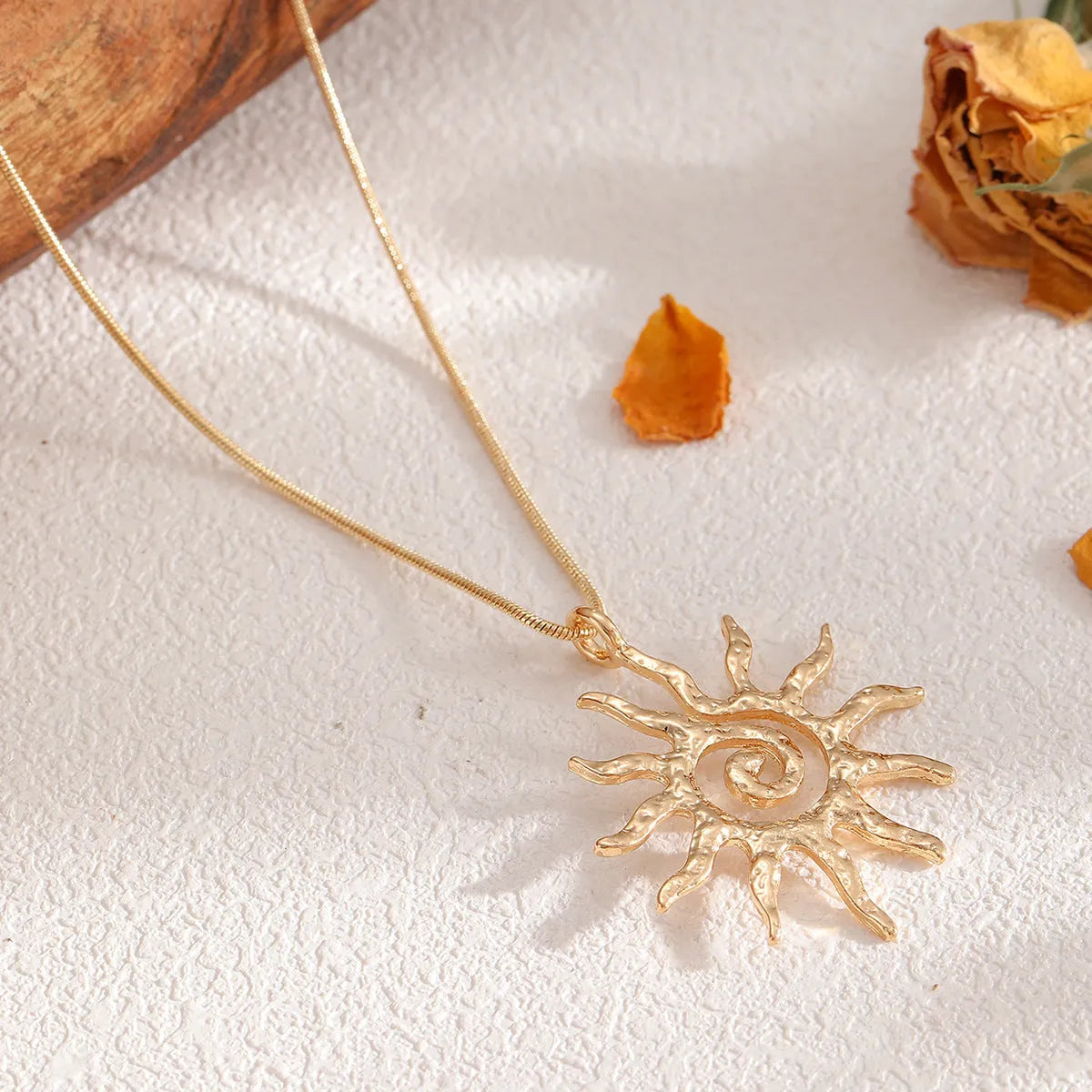 Gold sun hollow pendant necklace on regular chain with matching earrings and ring in zinc alloy electroplated finish