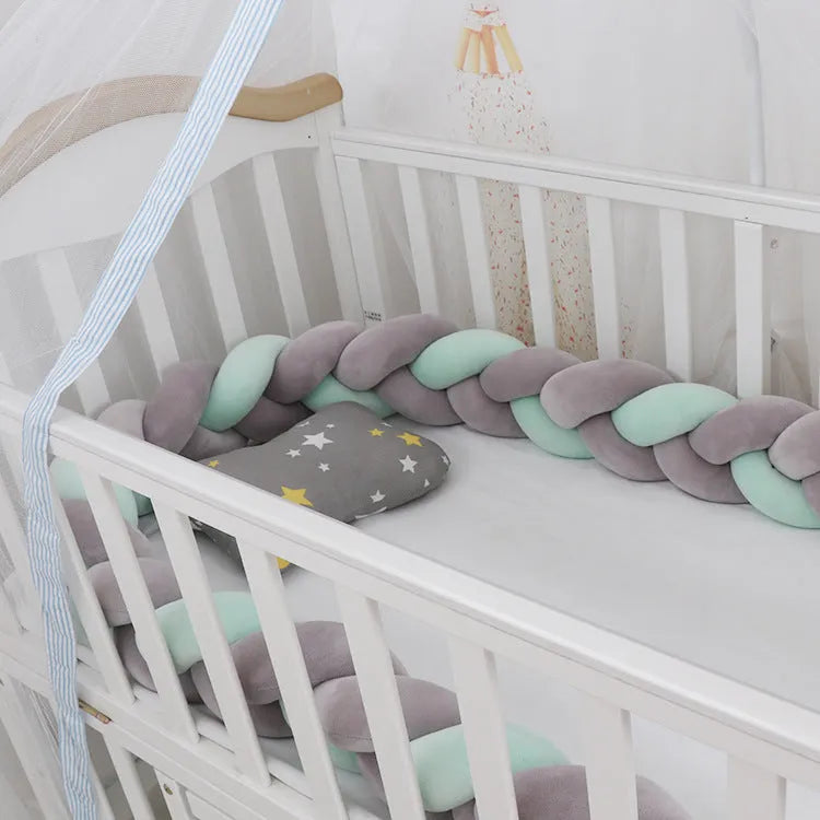 Braided knot crib bumper in spandex velvet, showing flexible length options for cot protection.