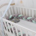 Braided knot crib bumper in spandex velvet, showing flexible length options for cot protection.