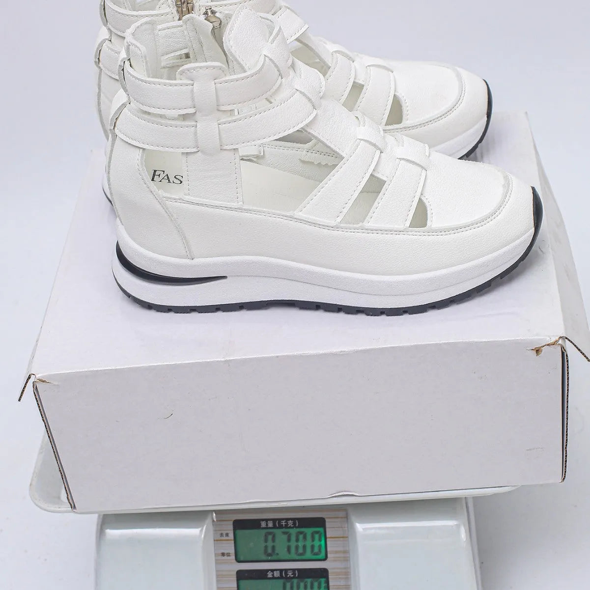 Women's black close-toed hollow-out platform sandals with Velcro strap on a white background