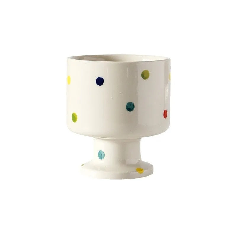 Hand-pinched irregular shaped ceramic mug in solid colour with modern simplicity design