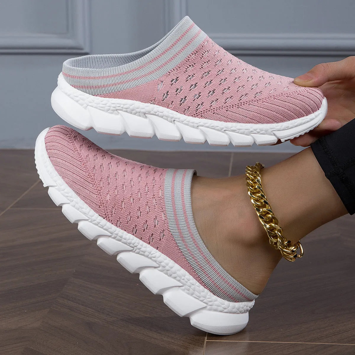 Women's black striped Flyknit socks semi slipper shoes with hollowed-out design and viscose sole.