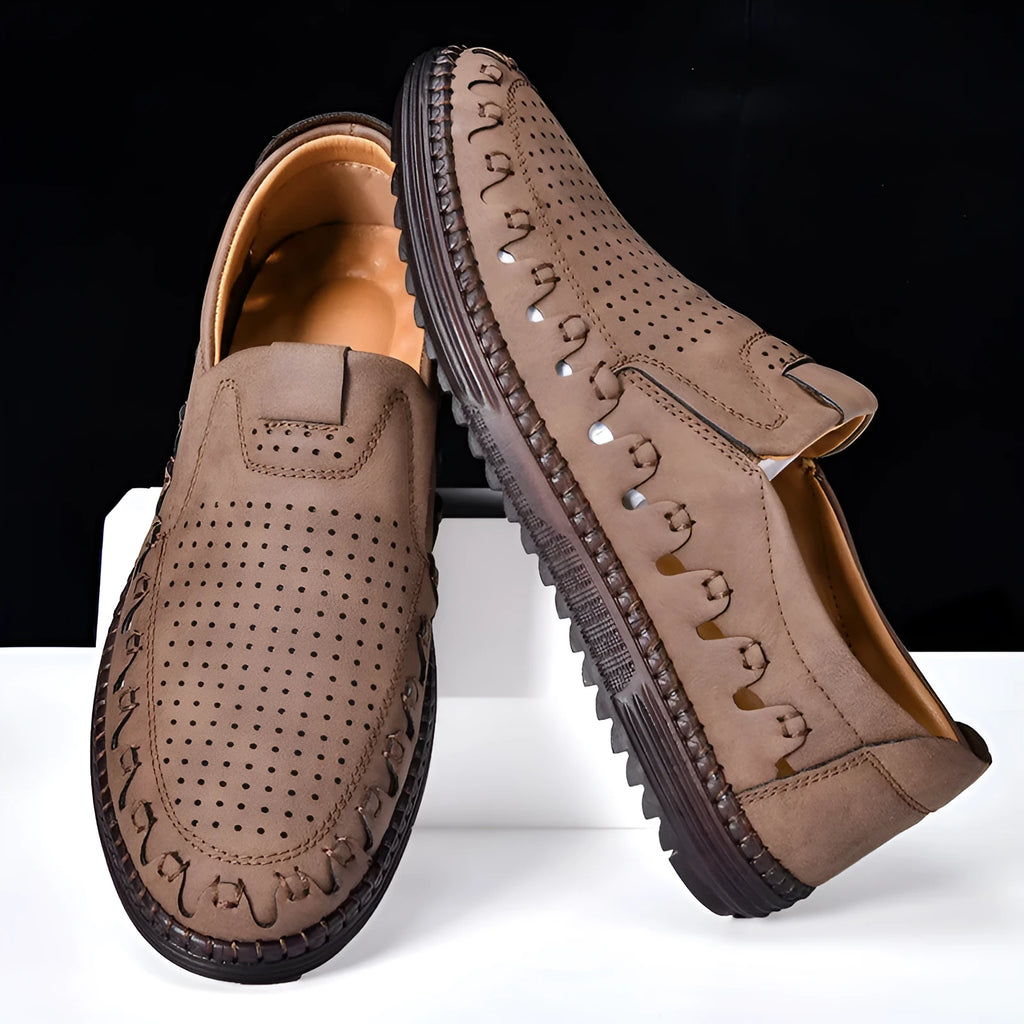 Men's brown casual slip-on shoes with round toe, flat heel, and sewn sole detailing.