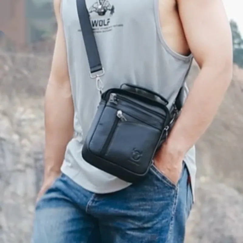 Black genuine leather men's shoulder messenger bag with retro styling on solid background