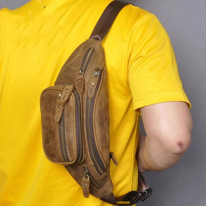 Brown leather retro messenger bag with single shoulder strap showing front compartment and silver hardware